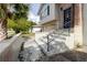 Close up view of the entrance to the home with stairs and a small wall at 7072 Scruboak Ln, Orlando, FL 32818