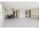 Open-concept layout featuring a large living area leading into a dining area with modern décor at 7072 Scruboak Ln, Orlando, FL 32818