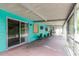 Covered patio with tiled flooring and screened-in enclosure for outdoor enjoyment at 7072 Scruboak Ln, Orlando, FL 32818