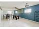This room is furnished with a table, chairs, and foosball table, offering versatile space at 7072 Scruboak Ln, Orlando, FL 32818