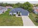 Beautiful aerial view of the home with lush lawn, new roof, and extended driveway at 1003 Edmund Ave, Dundee, FL 33838