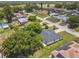 Community aerial view with homes featuring a harmonious blend of manicured lawns, lush trees, and well-spaced residences at 1003 Edmund Ave, Dundee, FL 33838