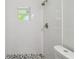 Bright walk-in shower with white tiling and stylish fixtures at 1003 Edmund Ave, Dundee, FL 33838