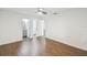 Spacious bedroom with hardwood floors leads to another bathroom at 1003 Edmund Ave, Dundee, FL 33838