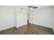 Clean bedroom featuring tile floors, closet space, and neutral decor at 1003 Edmund Ave, Dundee, FL 33838