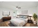 Serene bedroom with soft lighting, decor, and hardwood floors offers a calming retreat at 1003 Edmund Ave, Dundee, FL 33838