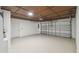 Garage with garage door, painted floors and ceilings, and a white entry door at 1003 Edmund Ave, Dundee, FL 33838