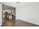 Bright kitchen with a center island, pendant lights, and stainless steel appliances offers a modern aesthetic at 1003 Edmund Ave, Dundee, FL 33838
