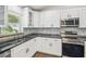 Well-equipped kitchen featuring sleek countertops, stainless steel appliances, and ample cabinet space at 1003 Edmund Ave, Dundee, FL 33838