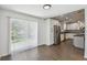 Bright kitchen with stainless appliances and a view to the patio at 1003 Edmund Ave, Dundee, FL 33838