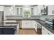 Modern kitchen with stainless steel appliances, sleek countertops, and ample cabinet space at 1003 Edmund Ave, Dundee, FL 33838