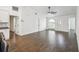Bright living room featuring a ceiling fan, tile floors, and a large window for natural light at 1003 Edmund Ave, Dundee, FL 33838