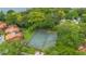 Aerial view of a community tennis court surrounded by green trees and homes at 1038 E Michigan St # 1, Orlando, FL 32806