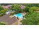 Aerial view of a community pool surrounded by green trees and manicured grounds at 1038 E Michigan St # 1, Orlando, FL 32806