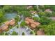 Community aerial view featuring a swimming pool, tennis courts and mature trees at 1038 E Michigan St # 1, Orlando, FL 32806