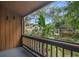 Balcony with lush greenery and partial view of nearby buildings at 1038 E Michigan St # 1, Orlando, FL 32806