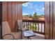 Outdoor balcony with seating, showcasing a pleasant neighborhood view on a sunny day at 1038 E Michigan St # 1, Orlando, FL 32806