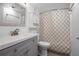Bathroom with a vanity, modern fixtures, and a shower with a decorative curtain at 1038 E Michigan St # 1, Orlando, FL 32806