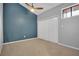 Bedroom with gray walls, carpeting, a ceiling fan, and a closet with folding doors at 1038 E Michigan St # 1, Orlando, FL 32806