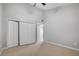 Bedroom with closet and light colored carpet at 1038 E Michigan St # 1, Orlando, FL 32806