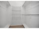 Walk-in closet with wire shelving and carpet flooring, providing ample storage space at 1038 E Michigan St # 1, Orlando, FL 32806