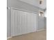 Bedroom closet with six paneled doors and a neutral color scheme at 1038 E Michigan St # 1, Orlando, FL 32806