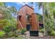 Two-story home featuring private balconies and lush landscaping offers a tranquil residential setting at 1038 E Michigan St # 1, Orlando, FL 32806