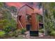 Two-story condo surrounded by lush tropical landscaping with stairs to upper level at 1038 E Michigan St # 1, Orlando, FL 32806