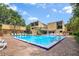 This community pool with a brick patio and chairs offers a relaxing outdoor space at 1038 E Michigan St # 1, Orlando, FL 32806