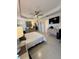 Relaxing primary bedroom with fan, tile floors, and contemporary furnishings at 2613 Drew Cir, The Villages, FL 32163