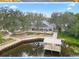 Beautiful clubhouse overlooking a pond with walking paths and mature trees for the community to enjoy at 2613 Drew Cir, The Villages, FL 32163