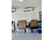 A garage with epoxy flooring, boxes and equipment at 2613 Drew Cir, The Villages, FL 32163