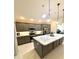Modern kitchen with granite countertops, stainless steel appliances, and an island at 2613 Drew Cir, The Villages, FL 32163