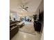 Spacious living room with modern furnishings, neutral color palette, and abundant natural light at 2613 Drew Cir, The Villages, FL 32163