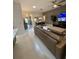 Open-concept living room features modern furnishings and neutral color scheme at 2613 Drew Cir, The Villages, FL 32163