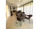 Sunroom featuring tiled flooring, modern lighting, and lots of natural light at 2613 Drew Cir, The Villages, FL 32163