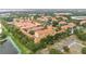 An aerial view of the community with mature trees, ponds, and well-maintained landscaping at 6133 Metrowest Blvd # 105, Orlando, FL 32835