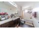 This bathroom offers an oversized vanity, a great-sized mirror, and a shower-tub combo at 6133 Metrowest Blvd # 105, Orlando, FL 32835