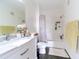This bathroom offers a marble vanity, a great-sized mirror, and a shower-tub combo at 6133 Metrowest Blvd # 105, Orlando, FL 32835