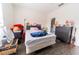 This bedroom offers great natural light, dark wood flooring, and a ceiling fan at 6133 Metrowest Blvd # 105, Orlando, FL 32835