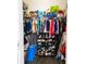 Organized walk-in closet with clothes, shoes, and storage solutions at 6133 Metrowest Blvd # 105, Orlando, FL 32835