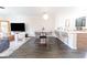 Open-concept dining area featuring a modern table setting and convenient kitchen access at 6133 Metrowest Blvd # 105, Orlando, FL 32835