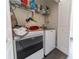 This laundry room provides a new washer and dryer and built-in shelving at 6133 Metrowest Blvd # 105, Orlando, FL 32835