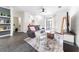 Comfortable living room featuring a plush couch, television, and open access to other living spaces at 6133 Metrowest Blvd # 105, Orlando, FL 32835