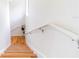 This staircase leads upstairs and offers beautiful hardwood steps at 6133 Metrowest Blvd # 105, Orlando, FL 32835