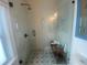 Modern bathroom with a glass-enclosed shower and bench seating featuring designer tile work at 734 Maryland Ave, Winter Park, FL 32789