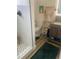 Modern bathroom featuring a glass-enclosed shower, toilet, and vanity with open shelving at 734 Maryland Ave, Winter Park, FL 32789