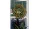 Close up shot of front door featuring a wreath and natural light at 734 Maryland Ave, Winter Park, FL 32789