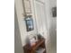 Hallway with white doors, artwork and shelving with tasteful decorations and reading material at 734 Maryland Ave, Winter Park, FL 32789