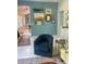 Bright living room featuring a blue wall, eclectic decor and a view into the kitchen at 734 Maryland Ave, Winter Park, FL 32789